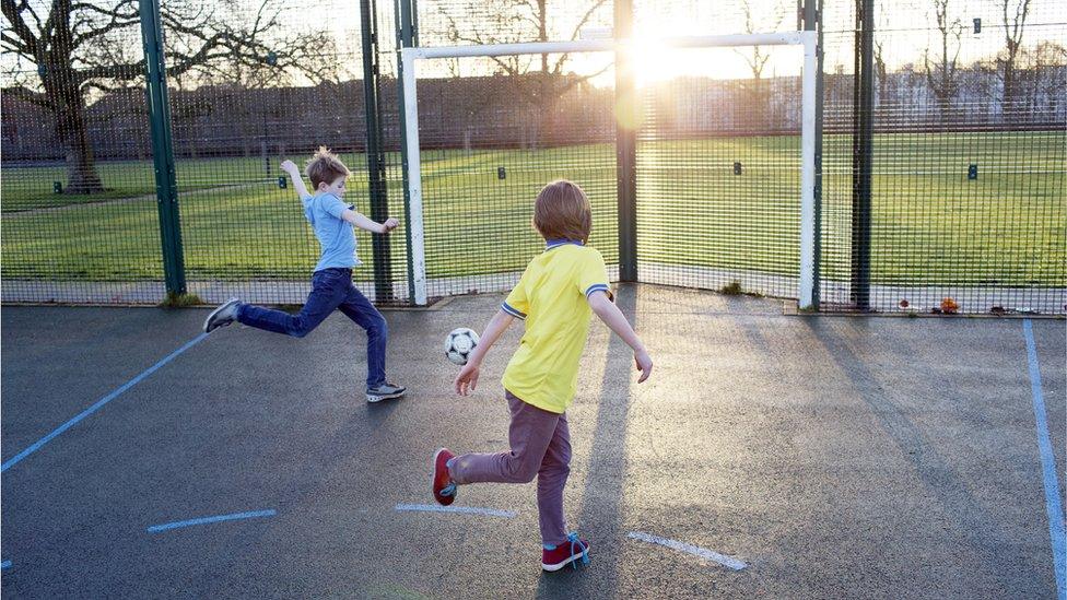 Boys playing football