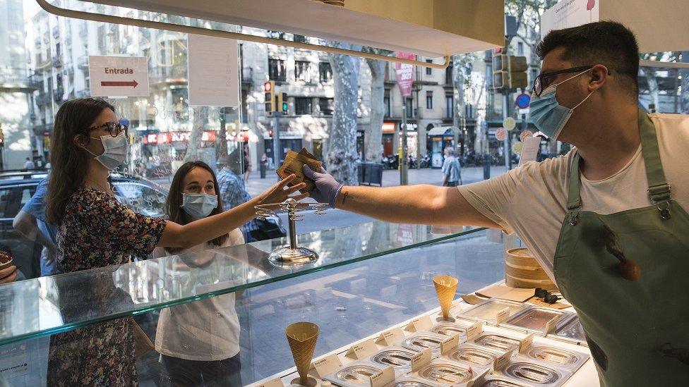 People visit a Rocambolesc ice cream store at La Rambla on July 27, 2020 in Barcelona, Spain. Spanish officials insisted it was still safe to travel to the country despite a recent rise in coronavirus