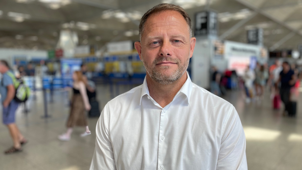 Nick Millar the operations director at Stansted airport standing in the airport check-in area