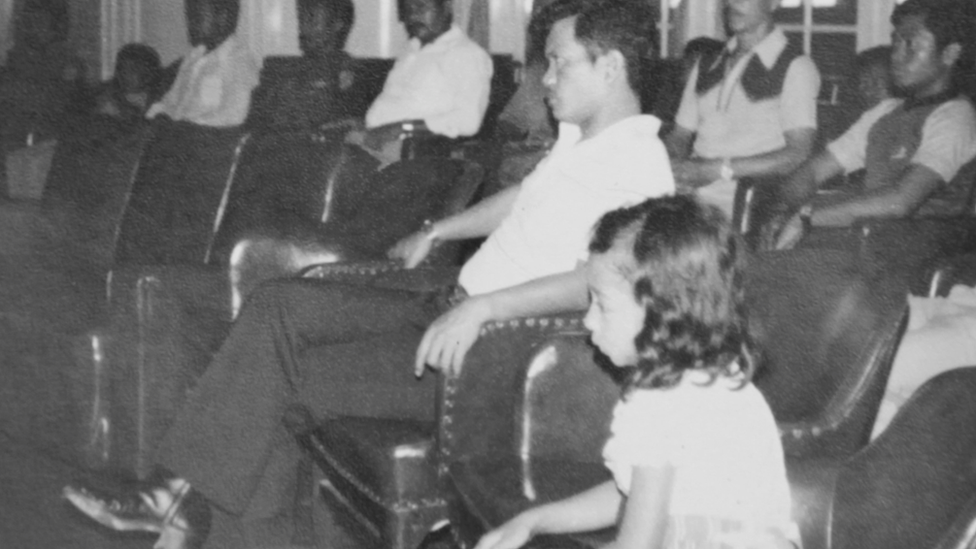 Nina with the soldier who took her sitting through mass at the chapel.