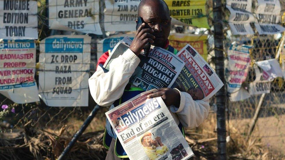 A newspaper seller in Harare on 7 September 2019, following the death of former president Robert Mugabe