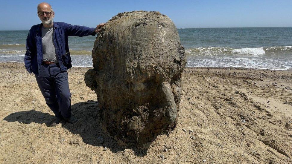 Laurence Edwards with sculpture of a head