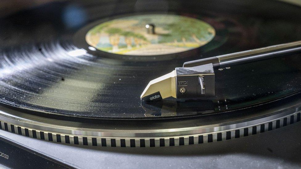 Record player needle on vinyl