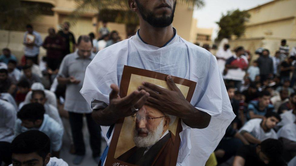 Bahraini demonstrators protest against the revocation of Sheikh Isa Qassim's citizenship