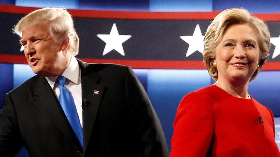 Republican U.S. presidential nominee Donald Trump and Democratic U.S. presidential nominee Hillary Clinton greet one another as they take the stage for their first debate at Hofstra University in Hempstead, New York on 26 September 2016