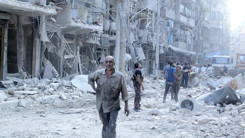 Residents look for survivors in a damaged site after what activists said was a barrel bomb dropped by forces loyal to Syria"s president Bashar Al-Assad in Al-Shaar neighbourhood of Aleppo, Syria September 17, 2015.