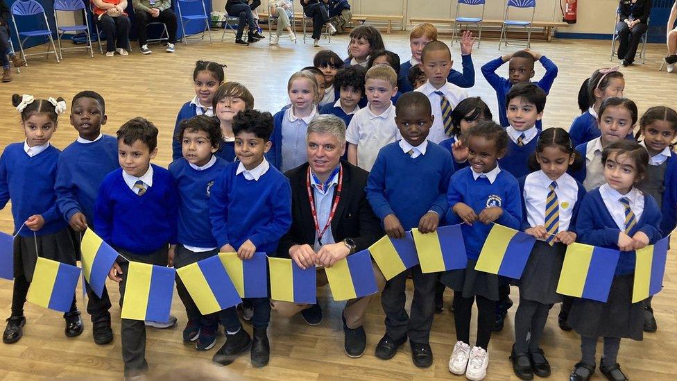 Ukrainian ambassador Vadym Prystaiko with children at St Nicholas Catholic Primary in Liverpool