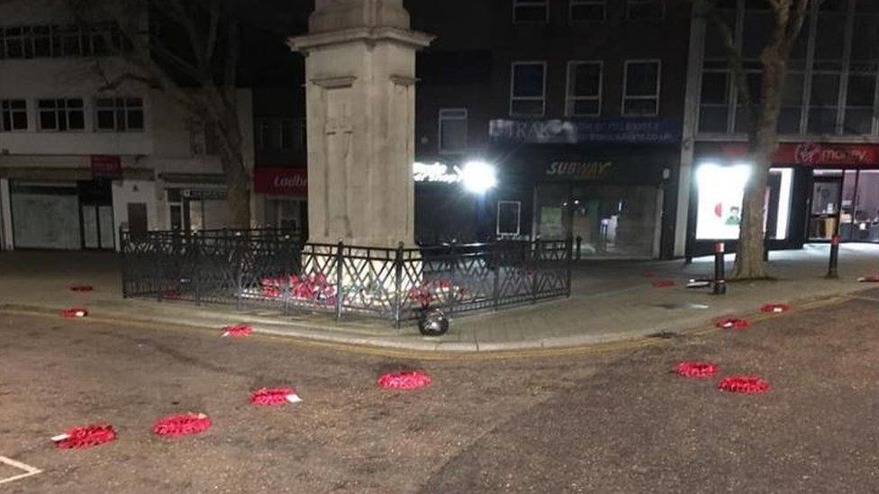 Wreaths strewn around the war memorial in Regent Street, Swindon