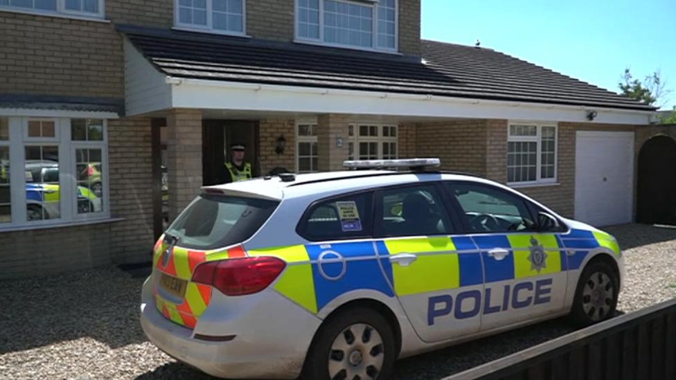 Police car outside house