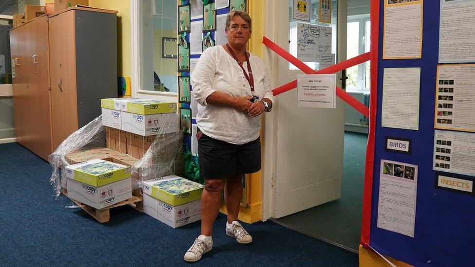 Caroline Evans, head teacher of Parks Primary School in Leicester stands next to a taped off section inside the school which contains RAAC