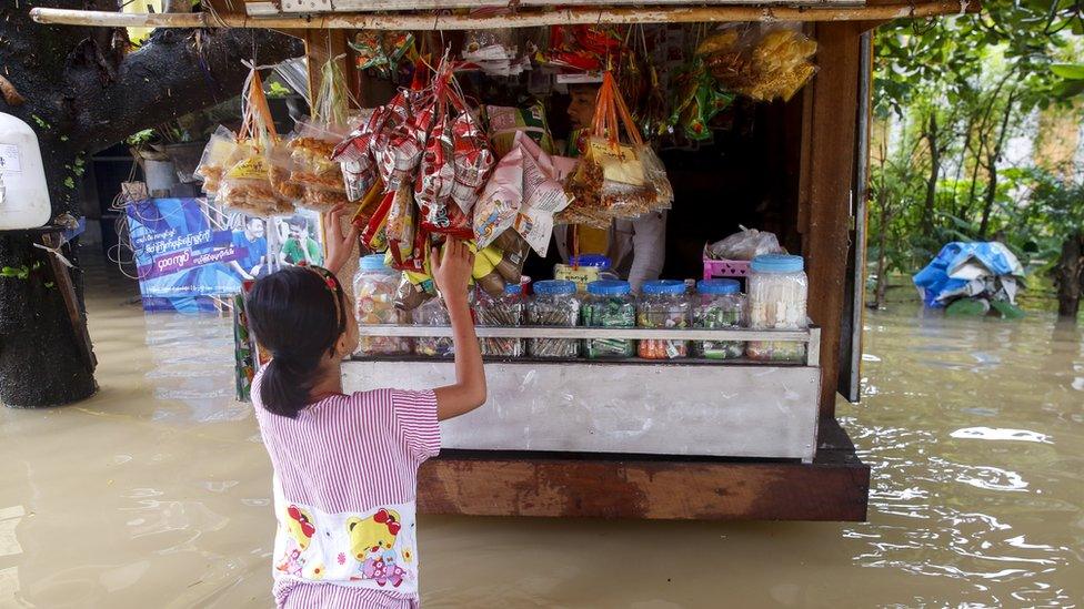 Flooded shop by the side of the road