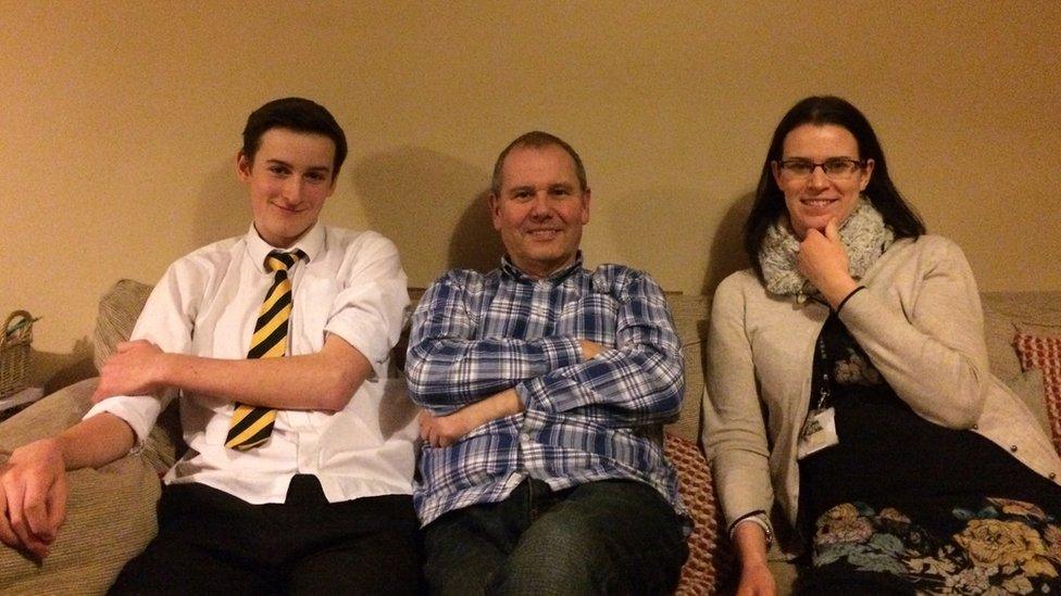 Pupil Callum, mother Kath and Grandad John Healy on the sofa