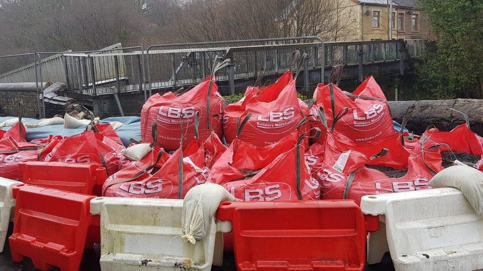 Sandbags on the Teddy Bear Bridge in Ystradgynlais, Powys, after part of the bridge collapsed on Tuesday