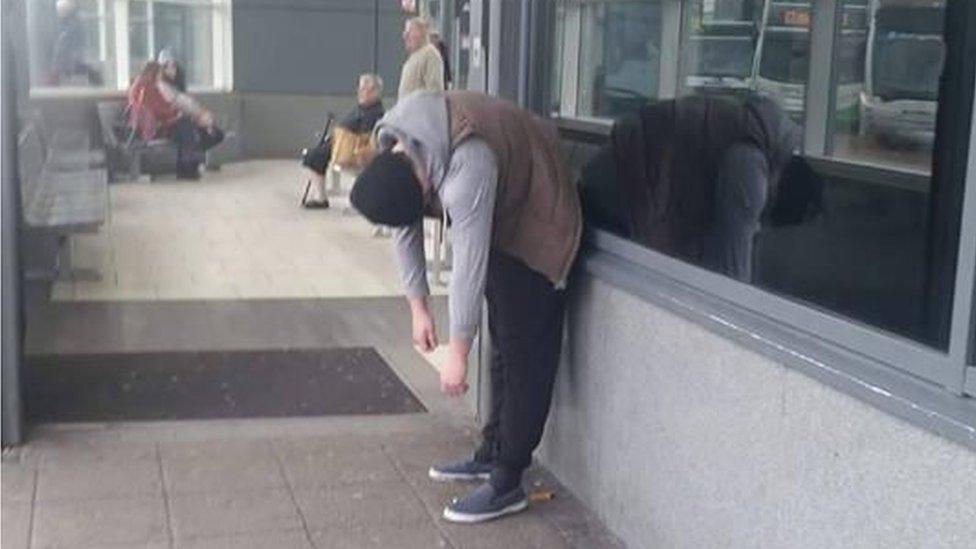 Man at bus station