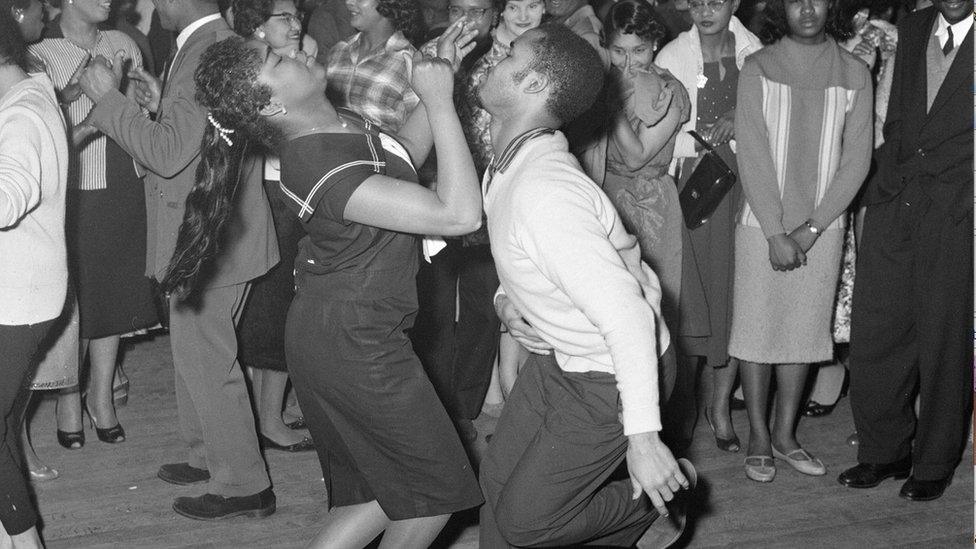 Crowds dancing at the first Notting Hill Carnival in St Pancras Town Hall