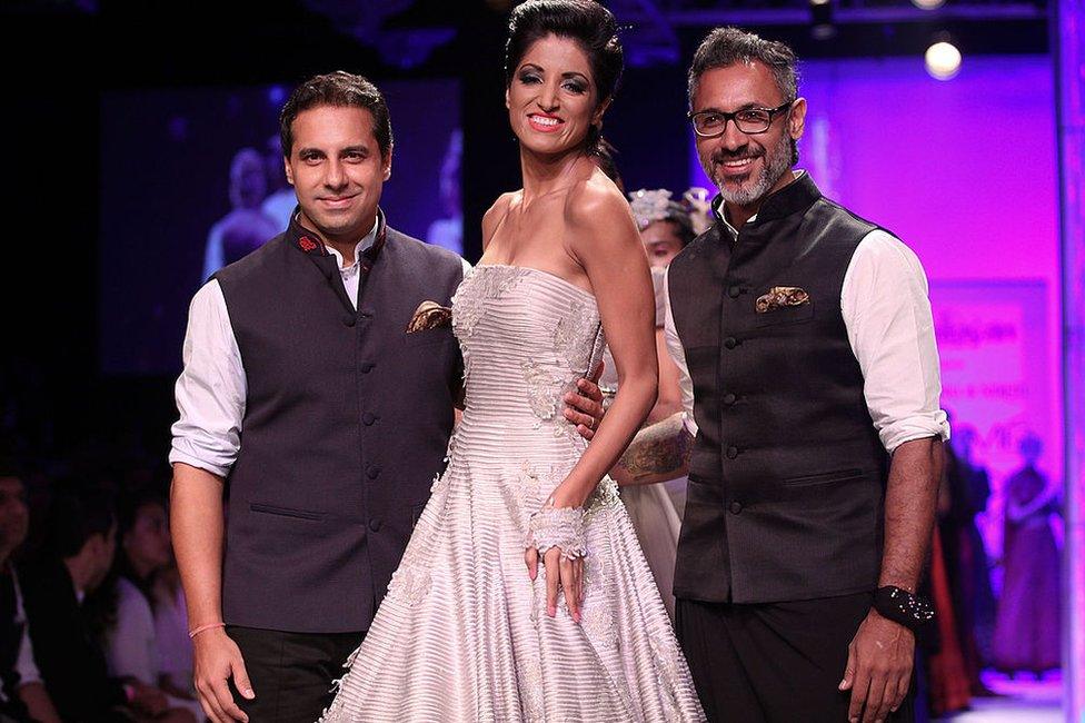 Jesse Randhawa (C) walks the runway with Shantanu Mehra (L) & Nikhil Mehra (R) during day 4 of Lakme Fashion Week Winter/Festive 2014 at The Palladium Hotel on August 23, 2014 in Mumbai, India.