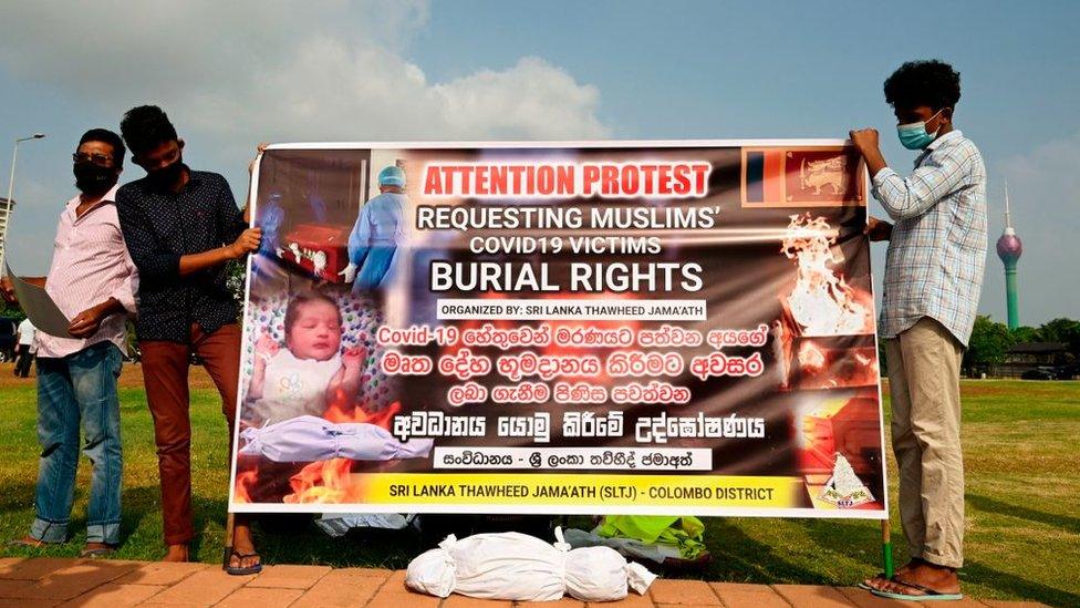 Sri Lankan Muslims hold a banner as they demonstrate near the office of President Gotabaya Rajapaksa, in Colombo on December 16, 2020.