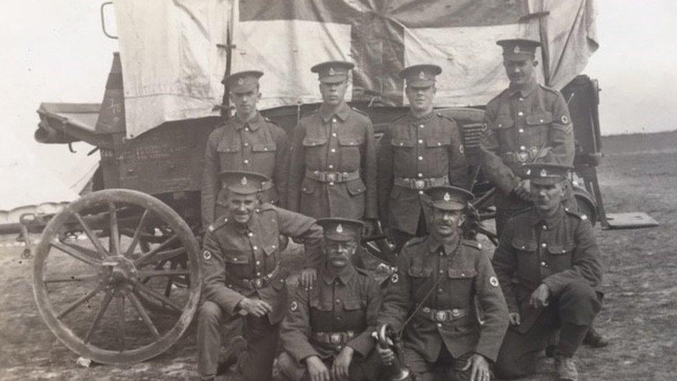 Mark Manning's great grandfather holding the bugle in front of a horse-drawn ambulance in France during WW1