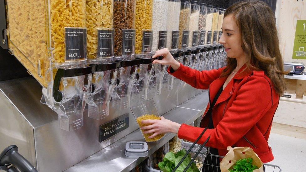 Woman trying Waitrose refill station