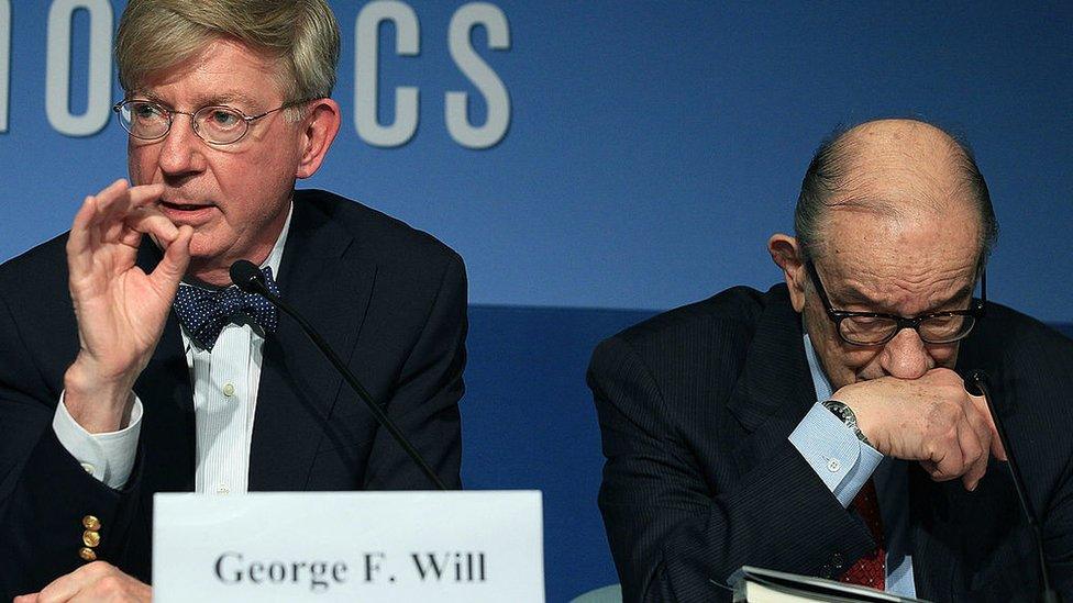 Will speaks beside former Federal Reserve chairman Alan Greenspan at a Washington event