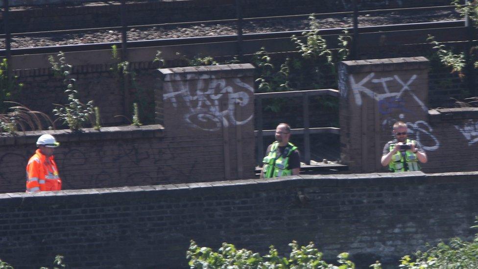 Officers taking photos at the scene