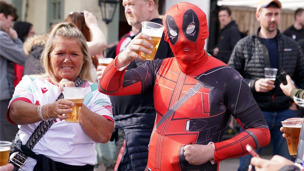 A Wrexham fan dressed as Deadpool