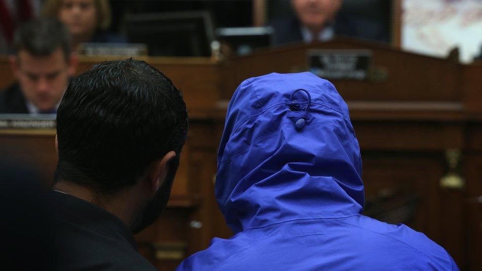 Caesar, hooded during the hearing