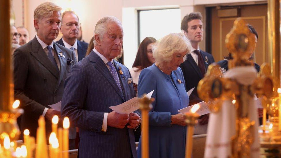 Prince of Wales and the Duchess of Cornwall observing the church service