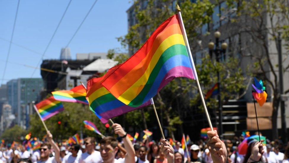 Marchers wave Gay Pride flag during the 2018 San Francisco Pride Parade on June 24, 2018 in San Francisco, California