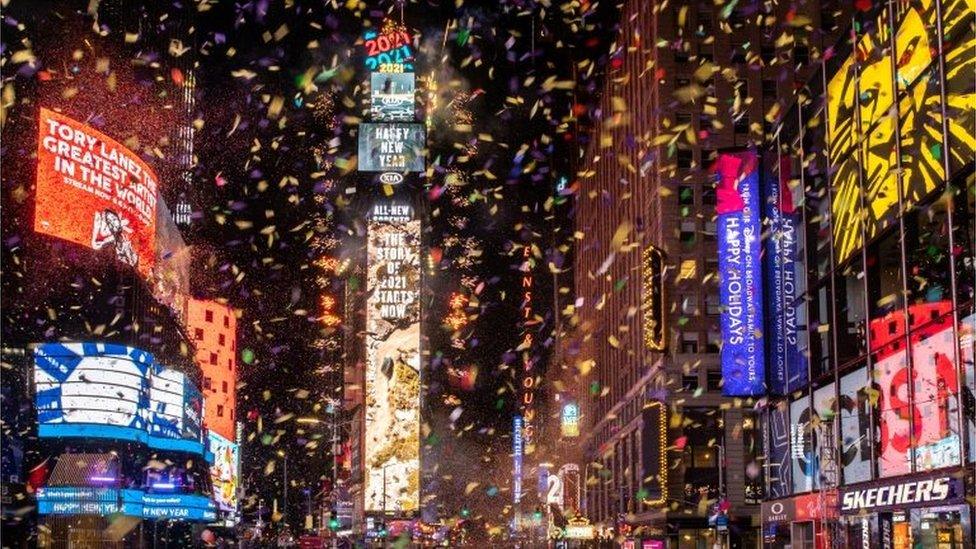 Confetti flies around in Times Square during the New Year celebrations