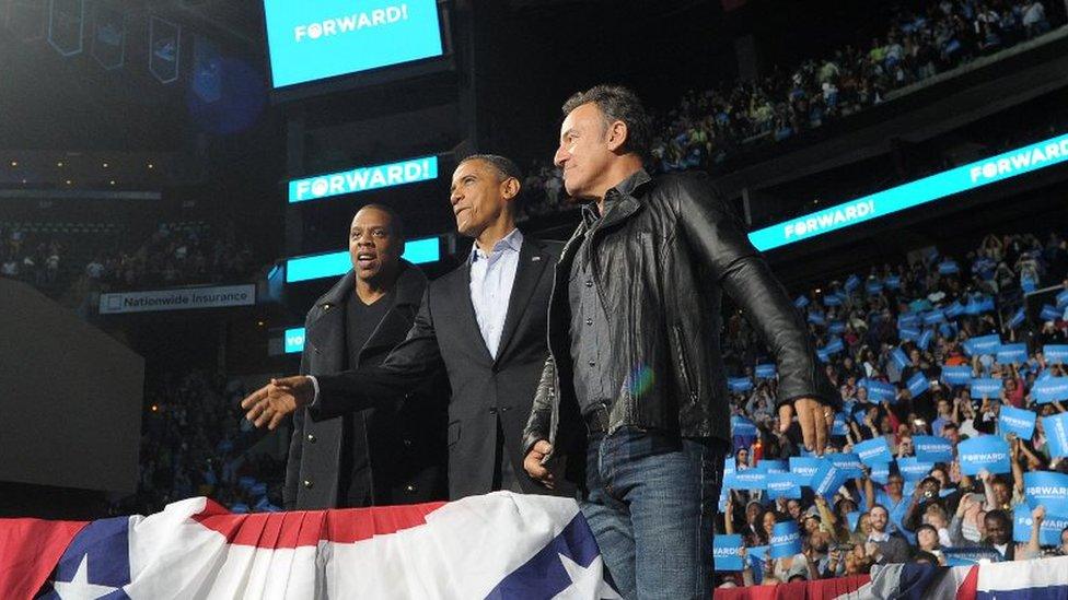 Singers Bruce Springsteen and Jay Z join US President Barack Obama on stage to greet supporters during a campaign rally in November 2012