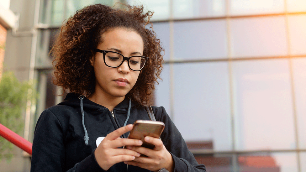 Woman looking at her smart phone