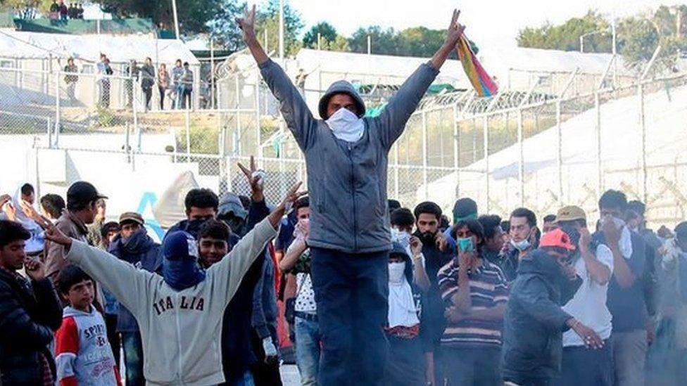 Migrants protest at the Moria migrant detention center Tuesday, April 26, 2016.