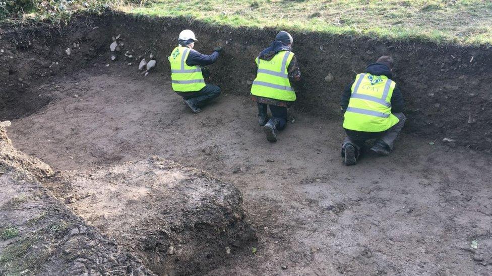 Archaeologists excavating a part of the site