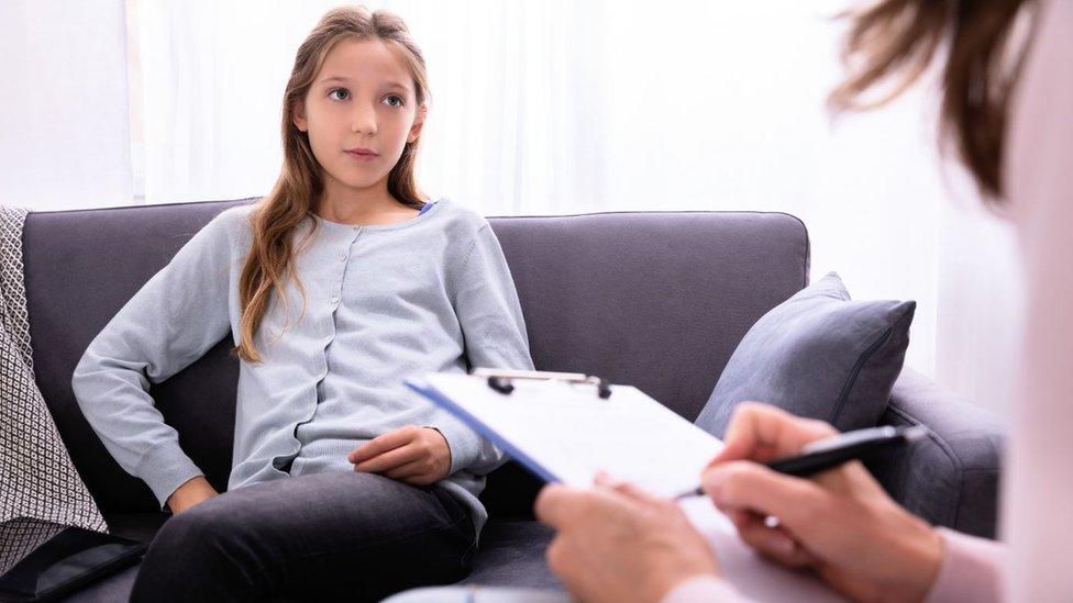 Child at psychiatrist - stock photo