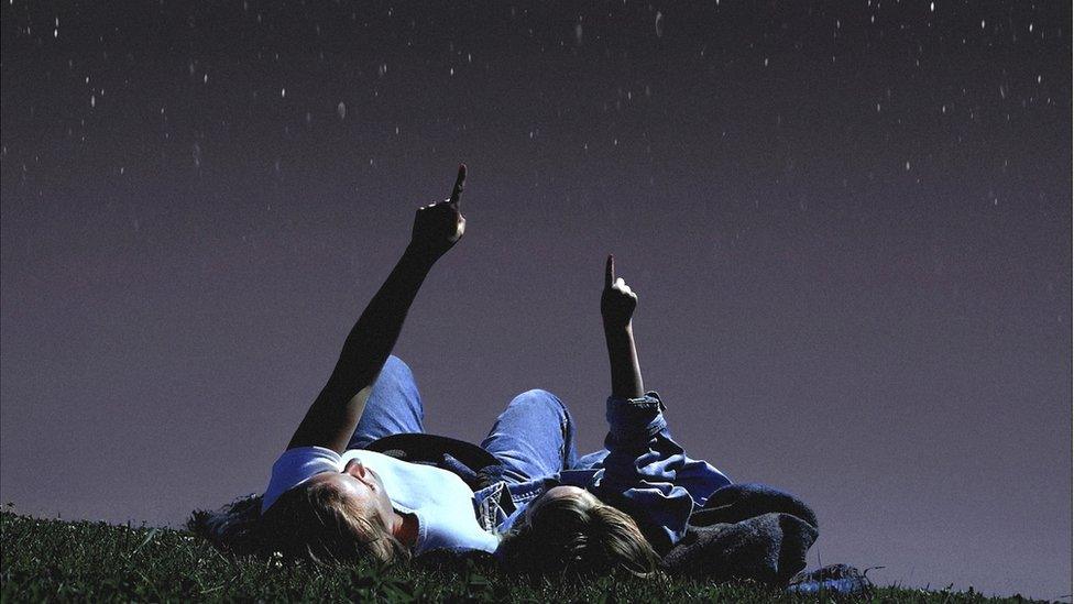 Mum and daughter looking at stars