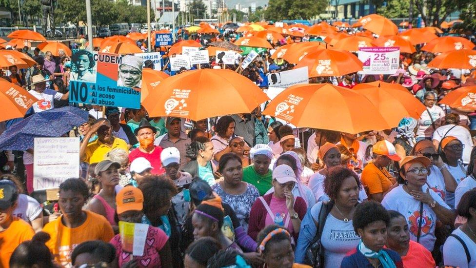 Demonstrators take part in a march to demand the decriminalisation of abortion on the International Day for the Elimination of Violence against Women in Santo Domingo