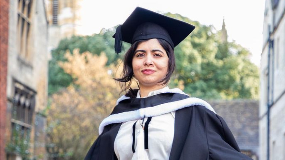 Malala in her graduation cap and gown