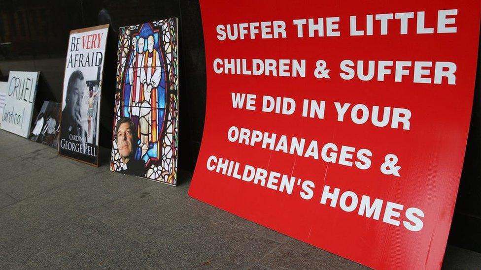 A protest poster at the Royal Commission into Child Abuse, Australia