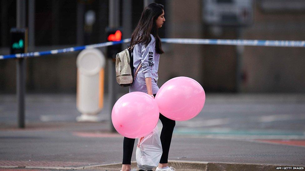 Young woman carrying balloons near the Manchester Arena attack