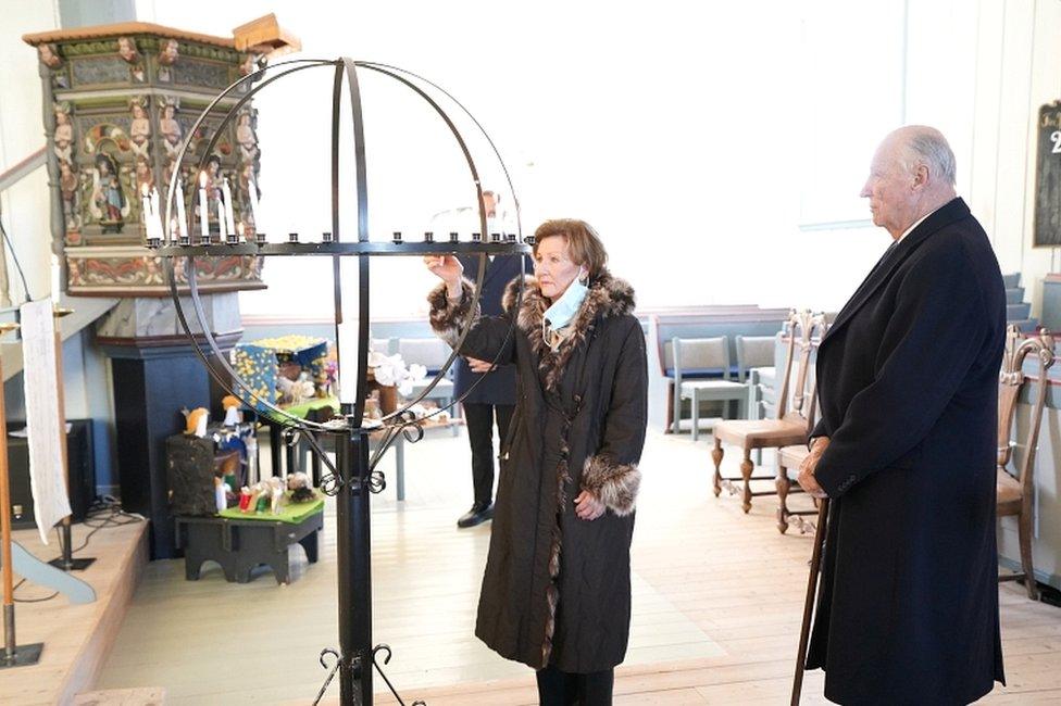 Norway's King Harald and Queen Sonja light candles in Gjerdrum Church in memory of the victims after the landslide in Ask, in Gjerdrum, Norway, on 3 January 2021