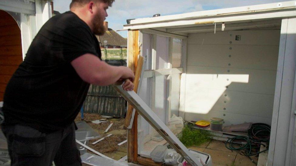 Oli clearing a garage