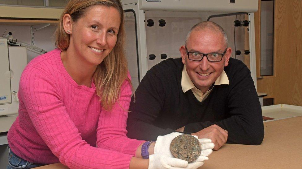 Iain Sansome (right) with Dr Lucy Shipley and the brooch