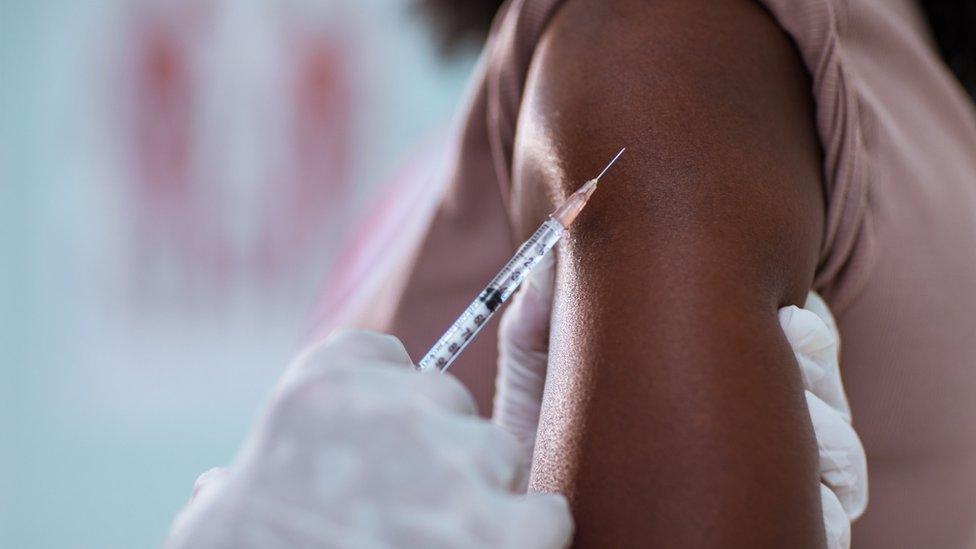 woman being vaccinated