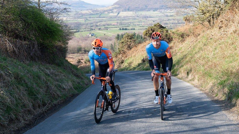 Brothers Charlie (left) and Harry Tanfield riding up Carlton Bank