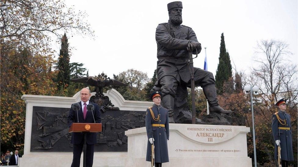 Vladimir Putin unveils the new Tsar Alexander III statue at a formal ceremony