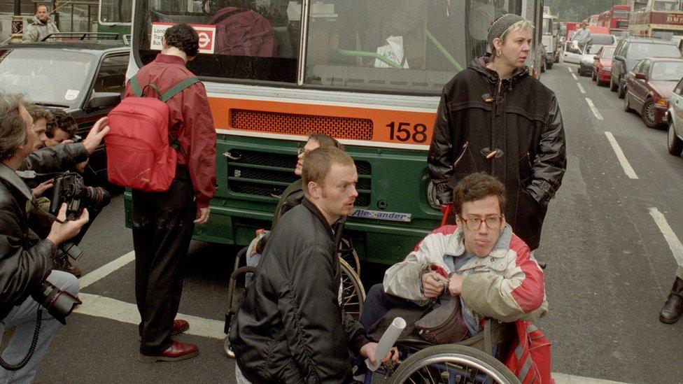 Protestors chain themselves to buses