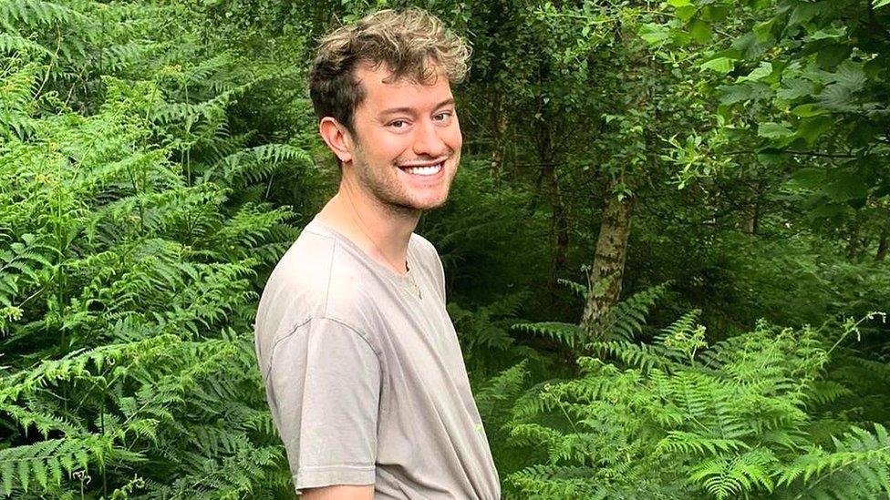 Jonathan Donaghy with trees behind him