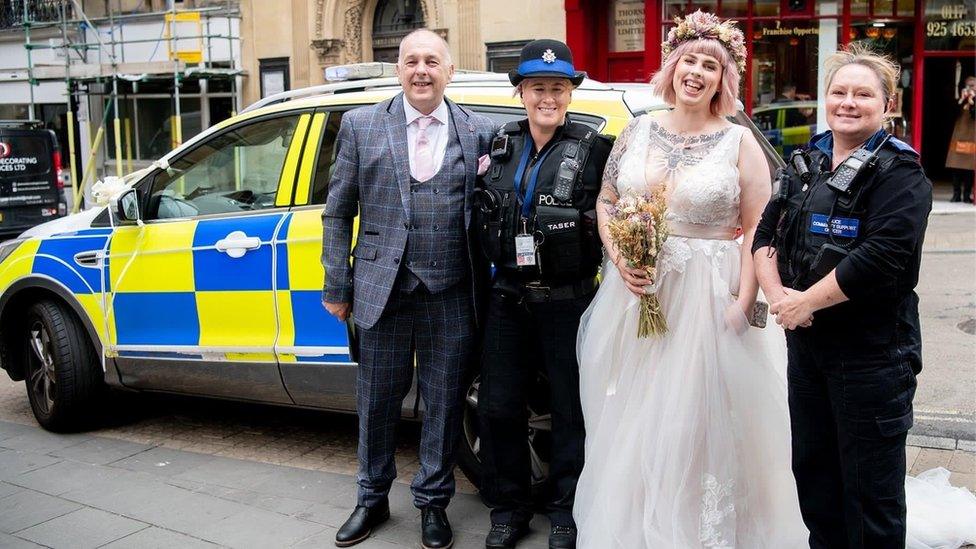 Yasmin Lovekin in wedding dress with father Colin, PC Griffiths and PCSO Turner