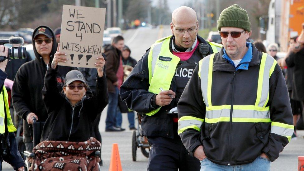 Police remove a man from a protest in support of Wet'suwet'en hereditary chiefs